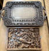 An anglo Indian carved twin handled tray together with a fish decorated wall plaque