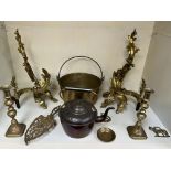 A pair of gilt metal fire andirons together with a copper kettle and cauldron, brass candlesticks,