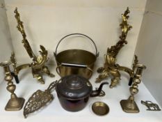 A pair of gilt metal fire andirons together with a copper kettle and cauldron, brass candlesticks,