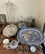A large glass jar and cover together with a smaller example, glass vase, blue and white meat plates,