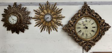 A modern gilt star burst wall clock together with other gilt wall clocks