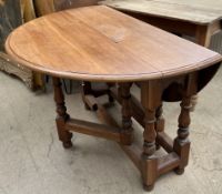 A 20th century drop leaf dining table,