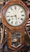 A walnut drop dial wall clock, with an octagonal frame and glazed door,