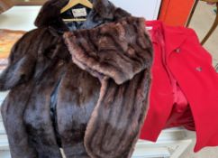 A Regency Furs coat together with a fur shrug and a red coat