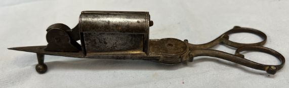 A 19th century steel wick trimmer and candle snuffers