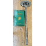 A Railway marker of oval form "1925" on a stake together with Russell (J.H.