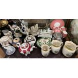 Three Victorian pottery teapots together with other teapots, cheese dishes and covers,