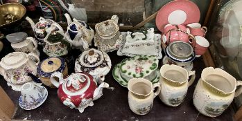 Three Victorian pottery teapots together with other teapots, cheese dishes and covers,