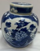 A Chinese porcelain blue and white ginger jar and cover decorated with birds and flowers,