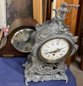 A white metal mantle clock together with another mantle clock and linen