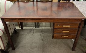 A mid-20th century rosewood desk,