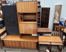 A mid 20th century coffee table of rectangular form with two square occasional tables that fit