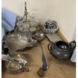 An electroplated six bottle cruet together with an electroplated dish, ladle,