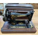 A Singer sewing machine cased