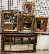 A walnut and gilt decorated wall mirror together with three other gilt decorated wall mirrors and a