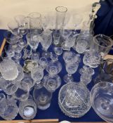 A glass decanter together with glass jugs,