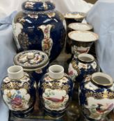 A pair of Booths scale blue vases together with other similar vases,