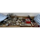 A pair of electroplated candlesticks together with assorted electroplated wares,