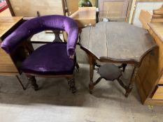 An upholstered horseshoe shaped chair,