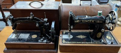 A Wheeler and Wilson sewing machine, cased together with a Singer sewing machine,