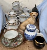 A Poole pottery dolphin together with a melba ware Labrador, USSR part tea set,