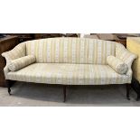 A 19th century mahogany settee with out swept arms on square tapering legs, spade feet and casters,