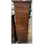 A 20th century mahogany chest with ten drawers on bracket feet