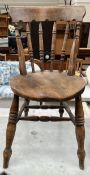 A 19th century provincial dining chair with a spindle back and circular seat