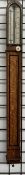 A 19th century oak stick barometer, with a domed top,