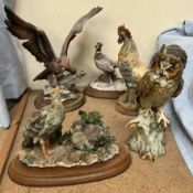 A continental porcelain long eared owl together with resin birds