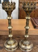 A pair of ecclesiastical brass candlesticks,