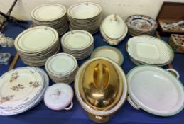 A continental porcelain part dinner set with a gilt rim and initials together with other pottery