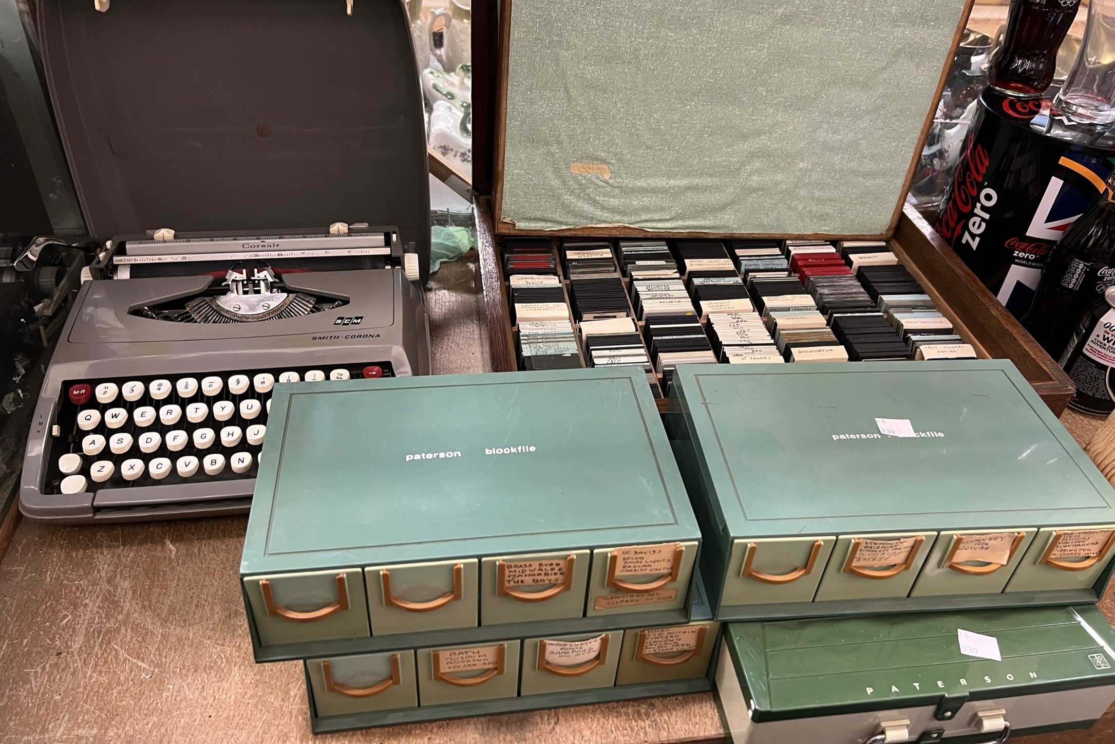 A Smith Corona typewriter together with a collection of photographic slides etc