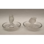 A Lalique glass pin tray with a central bird with tail raised, marked Lalique France,
