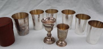 Asprey & Co a set of six silver plated graduating beakers with gilt interior,