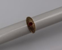 A yellow metal ruby and diamond ring,