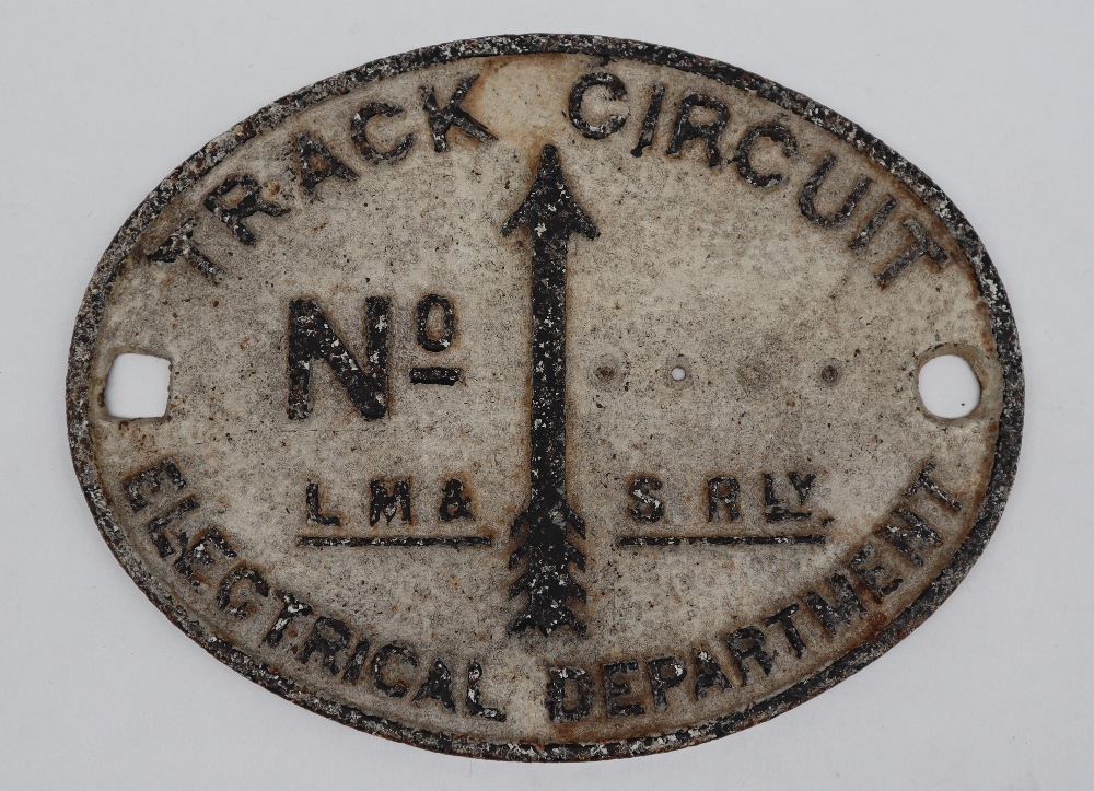 An LM & SR Track Circuit plate of oval form, 26.