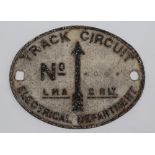 An LM & SR Track Circuit plate of oval form, 26.