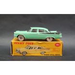 A Dinky Toys 191 Dodge Royal Sedan in pale green with black flash, spun hubs,