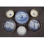 A pair of Salopian blue and white tea bowls and saucers transfer decorated in a variation of the