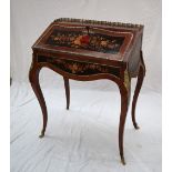 A 20th century French marquetry decorated kingwood ladies writing desk / bureau with a three