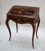 A 20th century French marquetry decorated kingwood ladies writing desk / bureau with a three