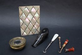 A mother of pearl card carrying case of rectangular form,
