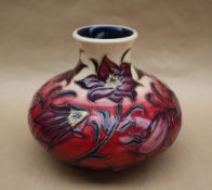 A Moorcroft pottery "Pasque flower" pattern squat vase, dated 2000, impressed and painted marks,