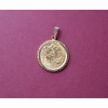 A George V gold sovereign, dated 1913 in a 9ct gold mount, approximately 9.