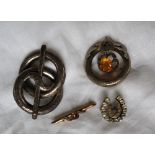 A garnet and seed pearl bar brooch together with a paste set horseshoe shaped brooch,