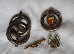 A garnet and seed pearl bar brooch together with a paste set horseshoe shaped brooch,