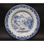 A Chinese porcelain blue and white plate, decorated with a landscape scene to the centre, 23.