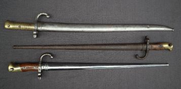 A 19th century French Gras bayonet, the 52cm blade inscribed Mre d'armes de St Etienne 8 - 1877,