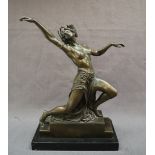 A bronze model of a semi naked maiden dancing, on a stepped base,